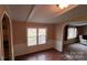 Bright dining room with wainscoting, laminate floors, and natural light at 350 Brawley Rd, Cleveland, NC 27013