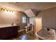 Bathroom featuring modern fixtures, a classic soaking tub, and neutral walls at 3607 Austin Rd, Monroe, NC 28112