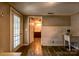 Bathroom with a sink, half-tiled walls, and a door leading outside to the porch at 3607 Austin Rd, Monroe, NC 28112