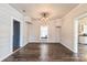 Bright dining area features wood-look floors and decorative ceiling light fixture at 3607 Austin Rd, Monroe, NC 28112