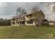 An angled view of the house highlighting the home's spacious yard and unique facade at 3607 Austin Rd, Monroe, NC 28112