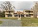 Inviting exterior view of the two-story home featuring a quaint front porch at 3607 Austin Rd, Monroe, NC 28112