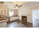 Charming kitchen with white cabinets, stainless appliances, and wooden flooring at 3607 Austin Rd, Monroe, NC 28112