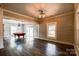 Bright open concept living room featuring hardwood floors, modern lighting, and shiplap walls at 3607 Austin Rd, Monroe, NC 28112