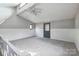 Loft featuring vaulted ceilings, skylight, wainscoting, and a neutral color palette at 3607 Austin Rd, Monroe, NC 28112