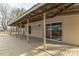 Large porch featuring a sliding glass door entrance to the home with wood railing at 3607 Austin Rd, Monroe, NC 28112