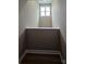 Finished attic with a small window and hardwood floors at 3667 Travertine Dr, Lancaster, SC 29720