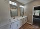 Double sink bathroom vanity with storage and large mirrors at 3667 Travertine Dr, Lancaster, SC 29720