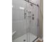 Tiled glass shower with silver hardware and built-in corner shelves at 3667 Travertine Dr, Lancaster, SC 29720