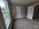 Bedroom features plush carpet, neutral walls and a window at 3667 Travertine Dr, Lancaster, SC 29720