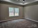 Neutral bedroom with large window, ceiling fan, and plush carpeting at 3667 Travertine Dr, Lancaster, SC 29720