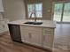 Bright kitchen island features stainless steel appliances, double sink, and outdoor view at 3667 Travertine Dr, Lancaster, SC 29720