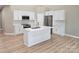 Spacious kitchen with white cabinets, stainless steel appliances, and a large center island at 3667 Travertine Dr, Lancaster, SC 29720