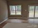 Living room with a large window and access to the outdoor deck at 3667 Travertine Dr, Lancaster, SC 29720