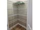 Corner pantry with white wire shelving and neutral walls and flooring at 3667 Travertine Dr, Lancaster, SC 29720
