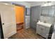 Bathroom featuring neutral paint, gray vanity, and wood grain flooring at 3672 Nc Hwy 127 Hwy, Hickory, NC 28602