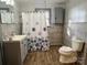 Bathroom featuring modern fixtures, a gray vanity, and tiled walls surrounding the shower at 3672 Nc Hwy 127 Hwy, Hickory, NC 28602