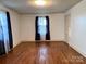 Bedroom featuring hardwood floors, fresh paint, and a window at 3672 Nc Hwy 127 Hwy, Hickory, NC 28602