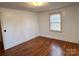 Bedroom featuring hardwood floors, neutral paint, and natural light streaming through the window at 3672 Nc Hwy 127 Hwy, Hickory, NC 28602