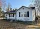 This beautiful home boasts classic architecture with white siding, black shutters, and a well-maintained lawn at 3672 Nc Hwy 127 Hwy, Hickory, NC 28602