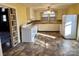 Functional kitchen features white cabinets, wooden countertops, tile flooring, and a classic ceiling fan at 3672 Nc Hwy 127 Hwy, Hickory, NC 28602