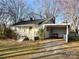 Inviting home features a covered carport, gravel driveway, and a charming porch, perfect for relaxing outdoors at 3672 Nc Hwy 127 Hwy, Hickory, NC 28602
