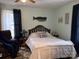 Charming bedroom with a comfortable bed, warm decor, and relaxing seating area, ideal for peaceful nights at 412 E Ross Grove Rd, Shelby, NC 28150
