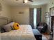Cozy bedroom featuring a comfortable bed with plush pillows, complemented by soft lighting and warm decor at 412 E Ross Grove Rd, Shelby, NC 28150