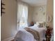 Charming bedroom with a comfortable bed, soft lighting, and calming decor, perfect for restful nights at 412 E Ross Grove Rd, Shelby, NC 28150