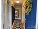 Inviting entryway featuring a modern rug, blue accent door, and convenient coat rack at 412 E Ross Grove Rd, Shelby, NC 28150