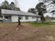Exterior elevation showing a home with white siding and covered front porch at 412 E Ross Grove Rd, Shelby, NC 28150