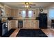 Well-lit kitchen featuring ample counter space, storage, and stainless steel appliances at 412 E Ross Grove Rd, Shelby, NC 28150