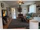 Bright living room featuring a wood stove, cozy seating, and views to the front porch at 412 E Ross Grove Rd, Shelby, NC 28150
