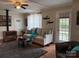 Comfortable living room with wood stove, cozy seating, and access to the outdoor patio at 412 E Ross Grove Rd, Shelby, NC 28150