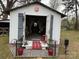 The shed has been renovated, featuring a sitting area and decoratice accents at 412 E Ross Grove Rd, Shelby, NC 28150