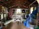 Interior view of a storage shed, filled with tables and stored items at 412 E Ross Grove Rd, Shelby, NC 28150