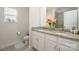 Bathroom featuring double sinks with granite countertops and white cabinets at 4427 Allenby Pl, Monroe, NC 28110