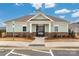 Charming clubhouse with stone accents and gated entrance to community pool at 4427 Allenby Pl, Monroe, NC 28110
