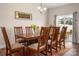 Open dining space with wood furnishings and sliding door access at 4427 Allenby Pl, Monroe, NC 28110