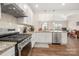 Well-equipped kitchen with stainless steel appliances and white cabinets at 4427 Allenby Pl, Monroe, NC 28110