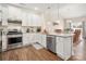 Open kitchen design with stainless steel appliances and granite countertops at 4427 Allenby Pl, Monroe, NC 28110