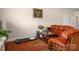Cozy living area displaying a sofa, chair and area rug at 4427 Allenby Pl, Monroe, NC 28110