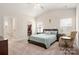 Bright main bedroom featuring a vaulted ceiling, ensuite bathroom, and walk-in closet at 4427 Allenby Pl, Monroe, NC 28110