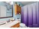 Cozy bathroom with a single sink vanity and a combined shower/tub unit at 4710 Nijinsky Ct, Charlotte, NC 28216