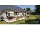 An outdoor patio featuring furniture, landscaping, and string lights for nighttime enjoyment at 4710 Nijinsky Ct, Charlotte, NC 28216