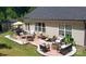 A serene backyard patio offers a relaxing spot with comfortable seating and a fire pit at 4710 Nijinsky Ct, Charlotte, NC 28216