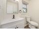 Updated bathroom features modern fixtures and clean white vanity at 510 Colony Acres Dr, Charlotte, NC 28217