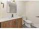 Updated bathroom features wood vanity, modern fixtures, and tile floor at 510 Colony Acres Dr, Charlotte, NC 28217