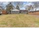 Quaint one-story home with gray brick, fresh exterior paint, and a spacious front yard at 510 Colony Acres Dr, Charlotte, NC 28217