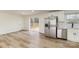 Bright kitchen featuring stainless steel appliances, white cabinetry, and sliding door to deck at 510 Colony Acres Dr, Charlotte, NC 28217